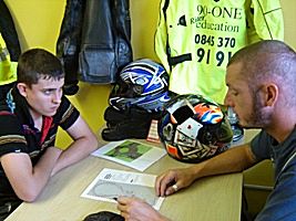 Classroom session explaining the requirements for the motorcycle test